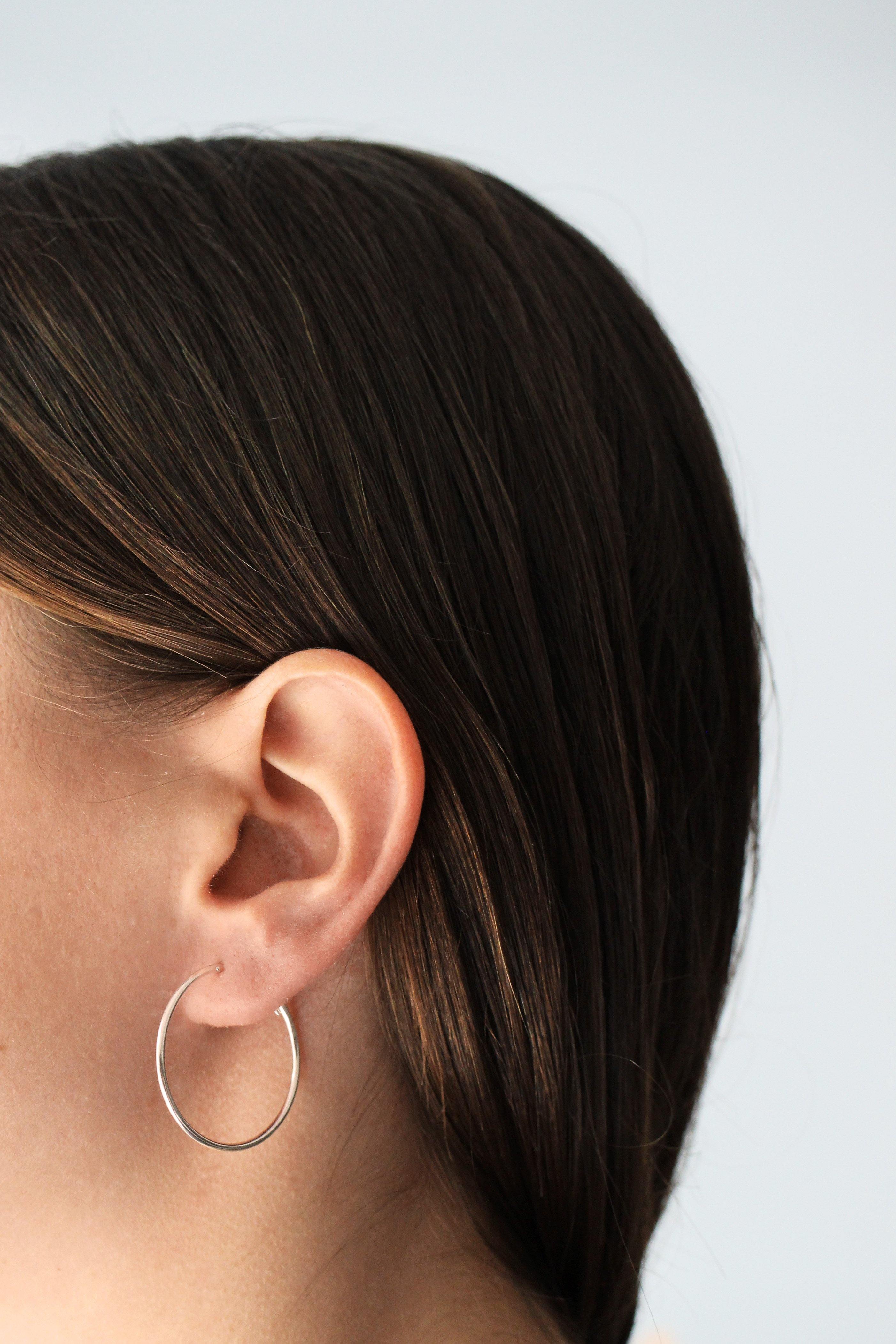 CROSS ON SMALL HOOP EARRING – Coexist Berlin